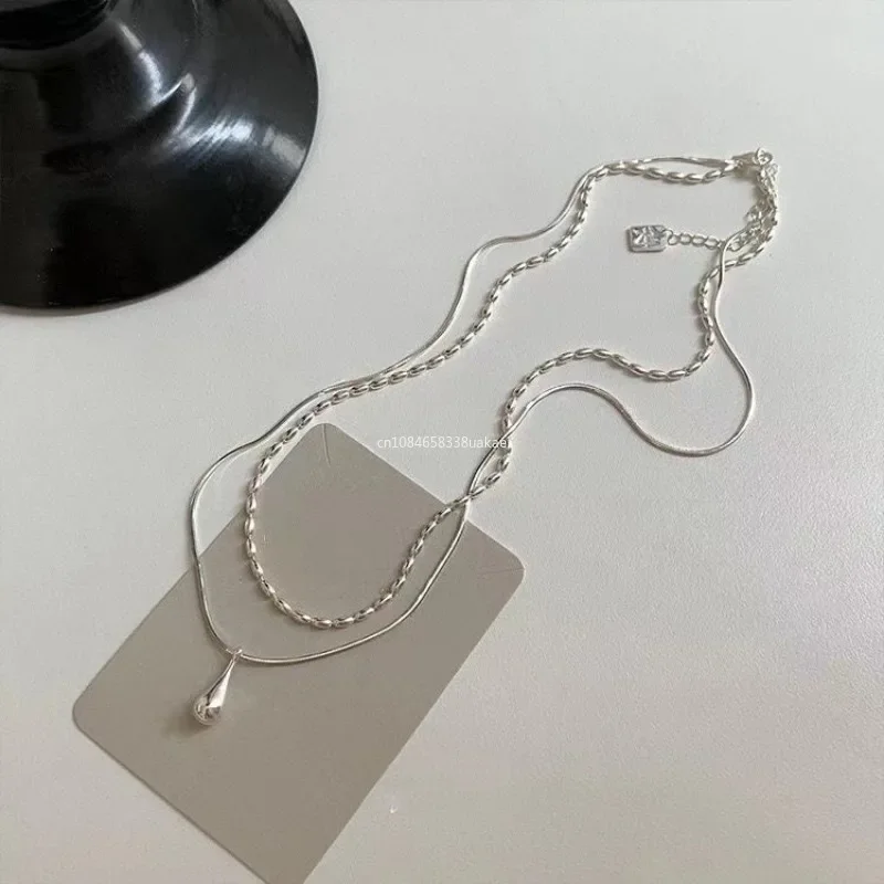 S0ea3d54cb0824bf0b9d4628f964568d4V.webp Silver Drop Pendant Necklace Double Layer for Women - Image 1