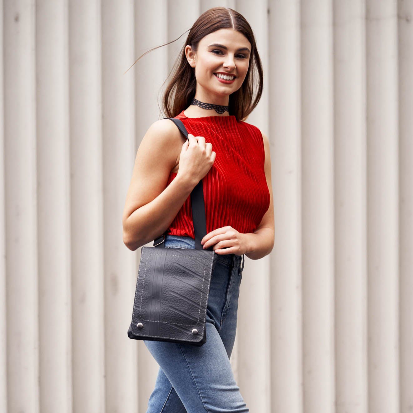 brand-recycled-rubber-crossbody-bag-worn-female-model-front-red-top.jpg Spencer Recycled Rubber Vegan Crossbody Bag (3 Sizes Available) - Image 1